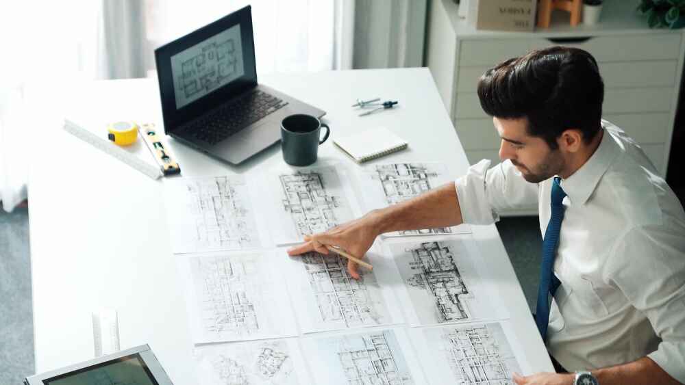 Structural engineers reviewing digital building models and design plans, representing the challenges and opportunities facing engineering firms in the Middle East.