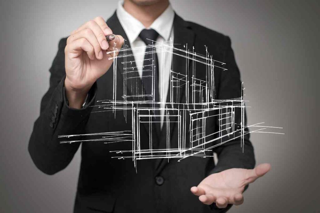 Businessman drawing a model of the house